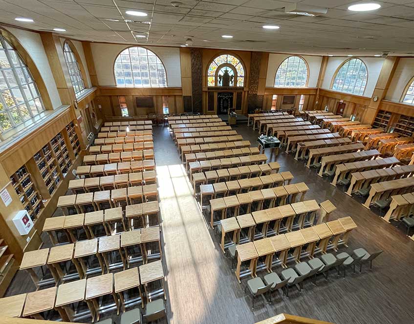 A large room with many tables and chairs