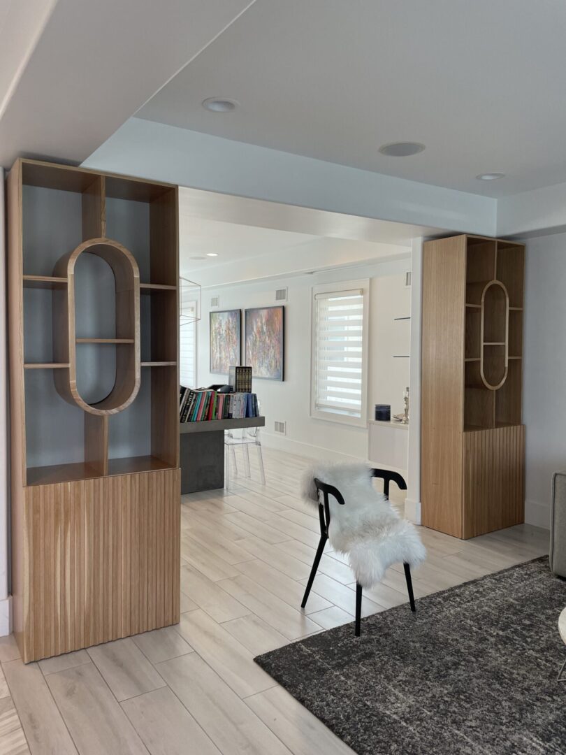 A room with wooden cupboards on both sides