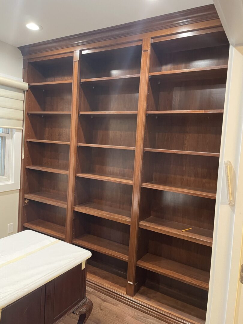 A wooden cupboard in a white room